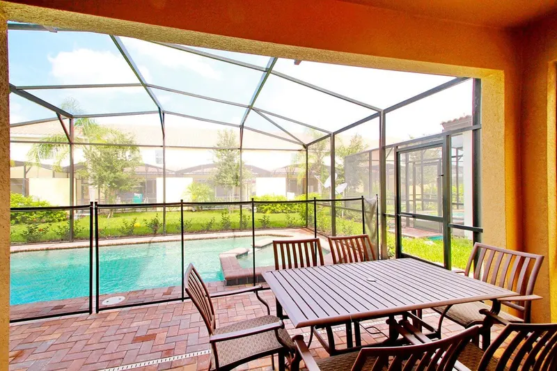 Enclosed sunroom with patio seating